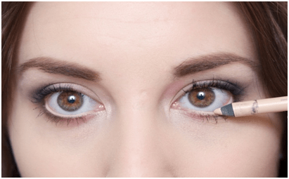 Line your waterline with a nude colored pencil to make them appear brighter
